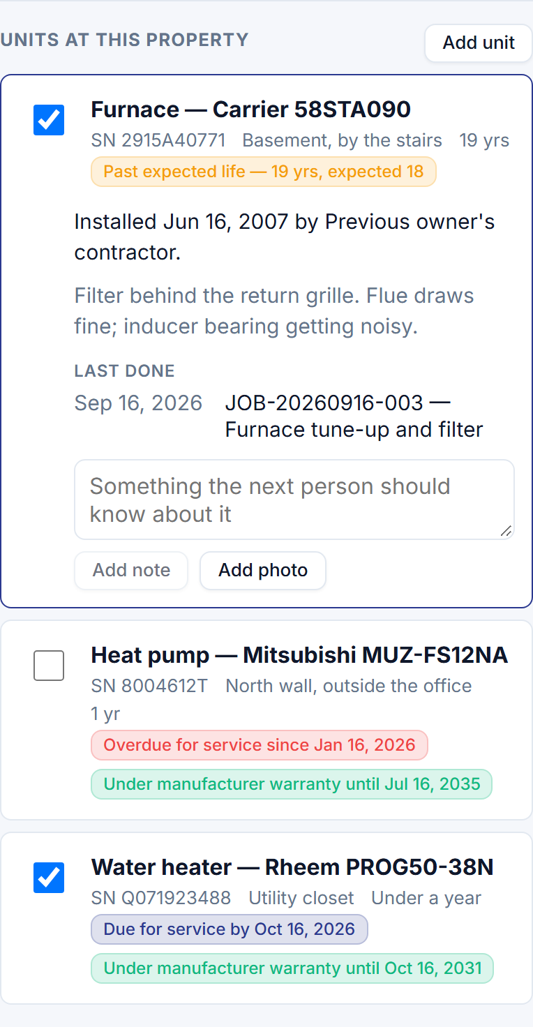 A visit on a technician's phone listing the units at the house — a furnace past its expected life and touched on this visit, a water heater under warranty and due for service — with the last things done to each.
